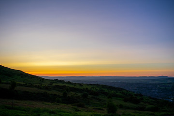 Colorful sunset at Cave Hill Country Park Belfast, Northern Ireland. Aerial view on City and hills 