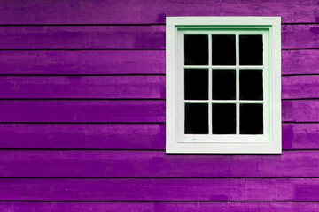 Multi pane colourful purple wall with white window