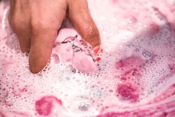 Bright natural fizzy bath bomb dissolves in the hands