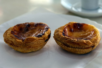 Pastel de Nata (PASTEIS DE NATA) - the traditional famous popular Portuguese pastries. A puff pastry basket with butter cream is the national dessert and pride of Portugal. Portuguese sweetness