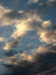 Obraz premium Magic sunset. Beautiful dark clouds at sunset after a thunderstorm. Dramatic and mysterious sky.