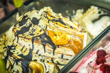 artisanal italian ice-cream - mix of ice-cream  flavours with fresh fruits, biscuits, cookies, macaroons