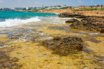  pristine seascapes with crystal clear blue water and yellow rocks in Ayia Napa, Cyprus