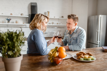 Love couple sitting at the table, romantic dinner