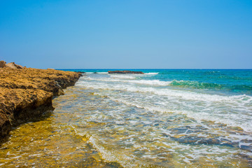  pristine seascapes with crystal clear blue water and yellow rocks in Ayia Napa, Cyprus
