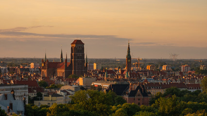 Fototapeta na wymiar Amazing cityscape of Gdansk, St. Mary's Basilica at the sunrise.