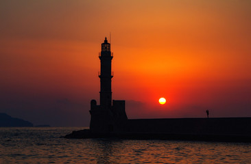 Lighthouse of Chania at summer sunset , Crete , Greece. Travel background