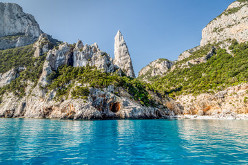 The monolith of Pedra Longa, Baunei, province of Ogliastra, East Sardinia, Italy. The rocky spire which rises majestically out of the sea. Holidays in Sardinia.
