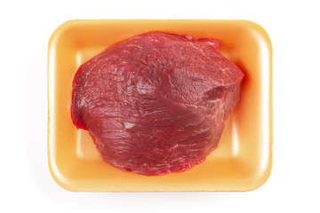 Plastic tray with raw meat isolated on white background. Top view. 