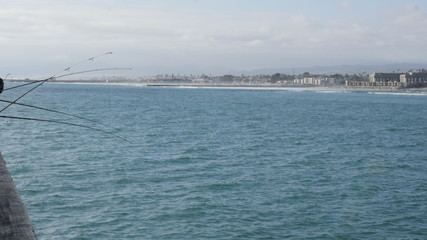 Fototapeta na wymiar Oceanside Pier California with beach coastline and fishing rods shot in high resolution 