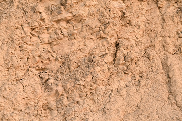 Wall of clay with a huge amount of small crumbs