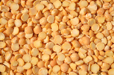 Dry split peas as a background texture. Close-up, top view