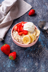 Oatmeal with strawberry, banana and ice cream