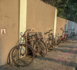 Fototapeta na wymiar Old cycles leaning against a blank wall