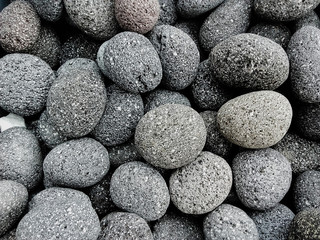 Round gray stones used to decorate the garden or parts of the house