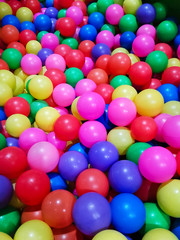 Fototapeta na wymiar High angle view of colored plastic balls in pool of game room