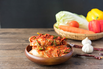 Traditional Korean Kimchi in a bowl on wooden background, top view, Korean food ,Korean food traditional cuisine. Fermented food. Vegetarian food good for health, Vegan Food for weight control diet