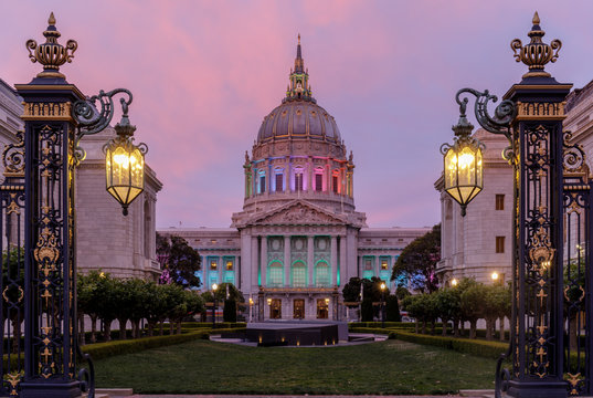 Twilight skies over San Francisco City Hall illuminated in rainbow colors for the Pride Parade.