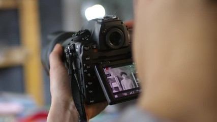 Close up shot of unrecognizable man holding camera while young woman recording tutorial for video blog