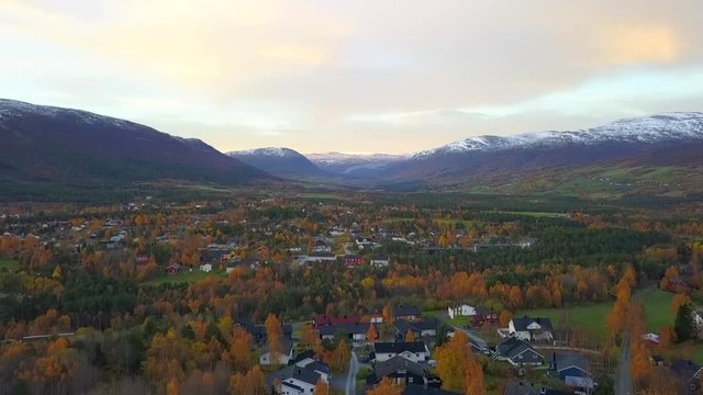 Aerial: Autumn in Scenic Town Among Snowy Mountains in Oppdal, Norway