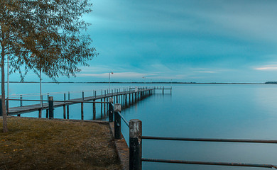 sunset on a pier on the lake