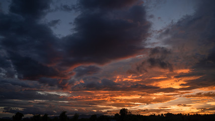 Obraz premium The sunset has beautiful colored clouds for background.