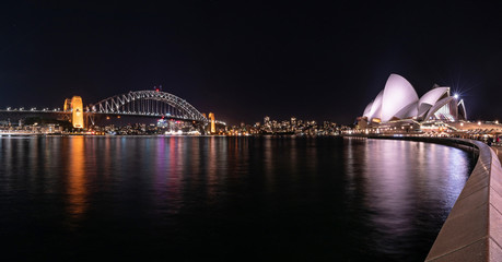 Night Cityscape : Wonderful Night view of Harbor Bridge and opera house with colourful city at Sydney, Australia. View from Sydney Harbour at night.