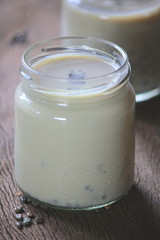 black sesame soy milk in glass on wood