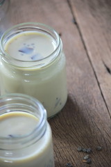 black sesame soy milk in glass on wood