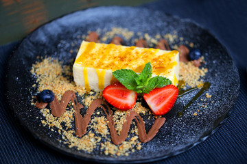 Photo of a big tasty sweet dessert with strawberries