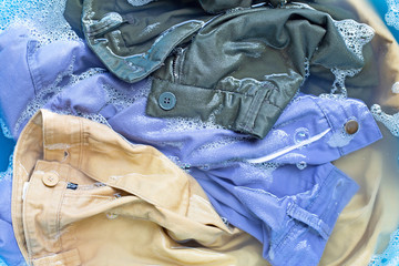 Trousers soak in powder detergent water dissolution. Laundry concept