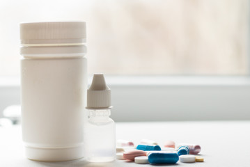 blue and white pills medicine on white background.