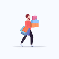 man carrying colorful paper bags and gift boxes young guy with purchases big sale shopping concept male cartoon character flat full length