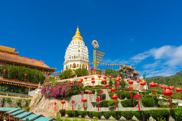 Yellow roof of Kek Lok Si Temple with Penang cityscape in Penang island, Malaysia - obrazy, fototapety, plakaty