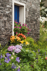 Fototapeta na wymiar window with flowers in the garden.