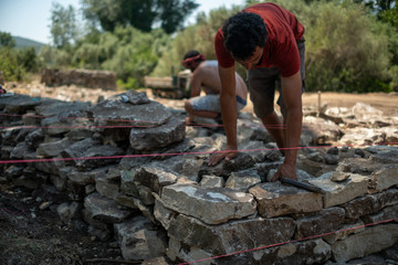 Dry stone wall construction in the south of France