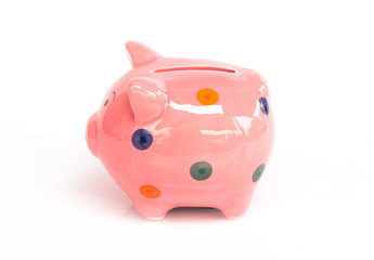 Pink ceramic piggy bank on white background, saving money concept