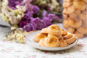 Cookies Singapore or cashew Cookies with dried vintage flower on vintage background