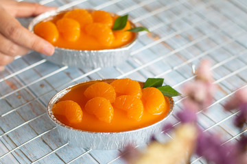 Homemade orange cake on wooden vintage table background