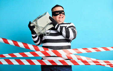 happy positive fat prisoner love his work, job, isolated blue background. studio shot