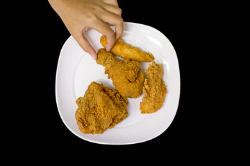 Crispy fried chicken on white plate, focus selective.