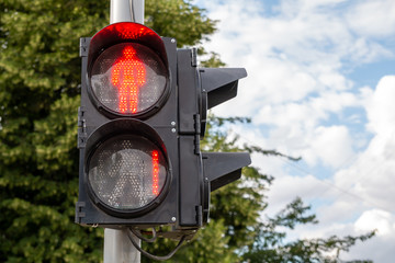 Red light at traffic lights for pedestrians. One second left.