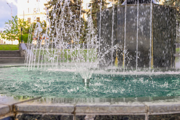 Close Up Of Water Stream Splashing Fountain