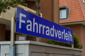 Road sign to a bike rental business
