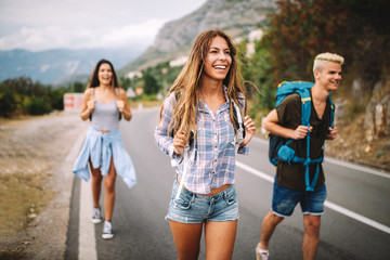 Group of happy friend traveler walking and having fun. Travel lifestyle and seasonal vacation concept