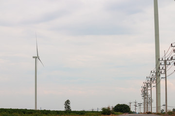 Wind turbine farm power generator in beautiful nature landscape for production of renewable green...
