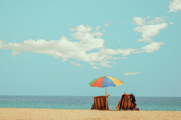 Beach chair on tropical beach with calm sky. sea view and sand beach, summer vacation background. retro color tone effect.