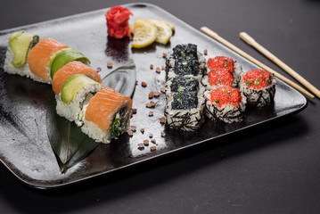 Sushi with caviar on black