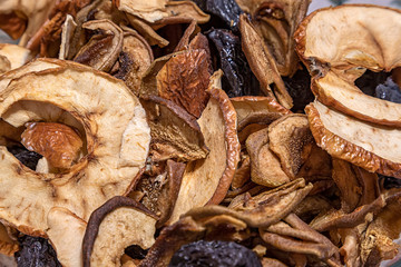 Close up of mixed dried fruit, prunes and sliced apples. Seasonal food