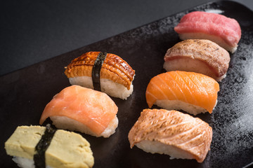 sashimi sushi set on black background